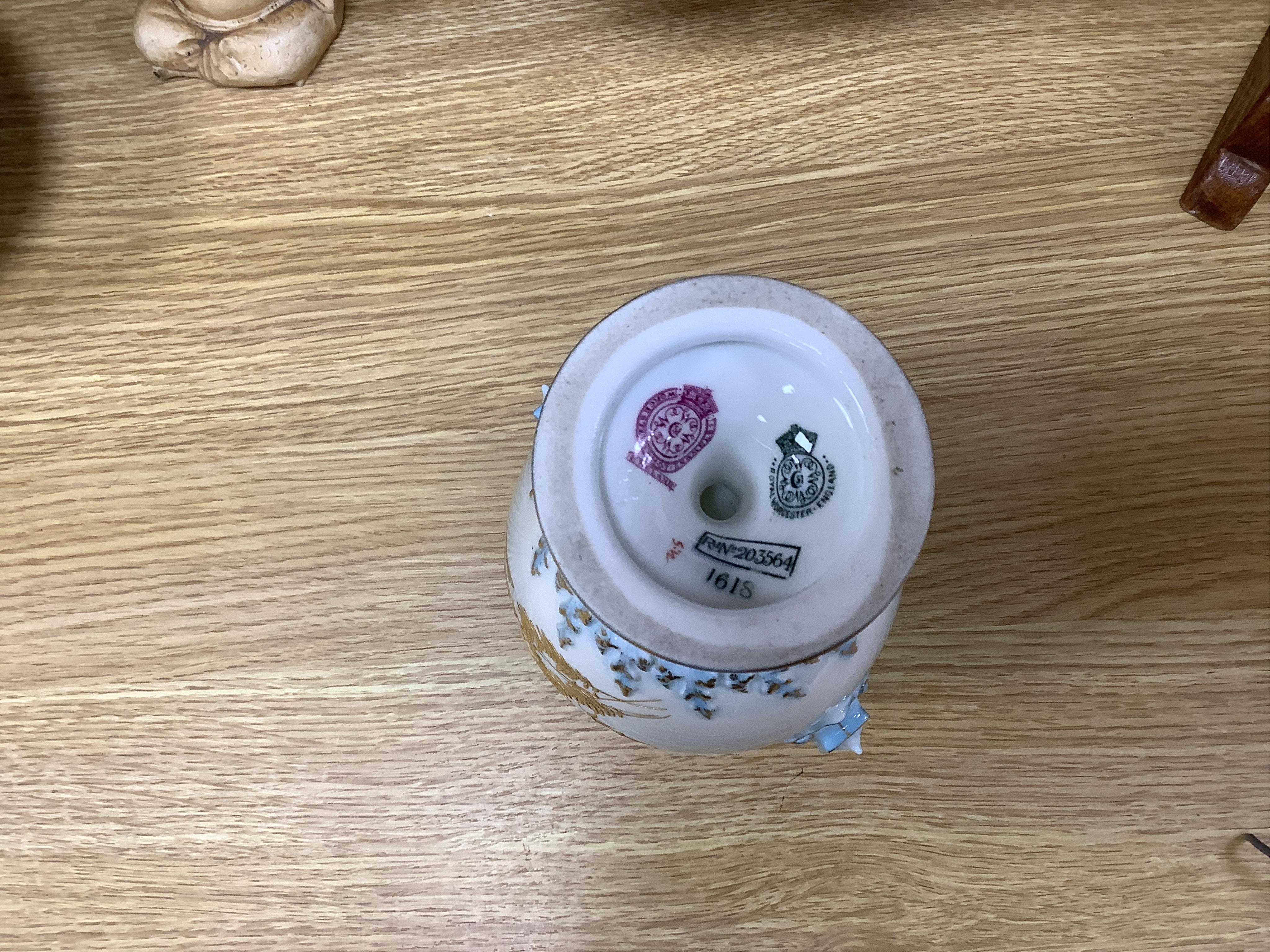 A Royal Worcester vase and cover, shape 1618 decorated with ferns and insects, a similar blush ivory bottle vase and a pot pourri vase and cover decorated with roses, tallest 24cm